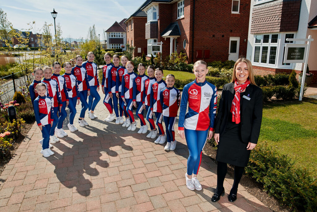 Redrow has donated funds to members of the Sophie Dee Dance school who are off to the World Championships in Spain. Pictured with some of the dancers is Redrow Sales Consultant Kelly Toner