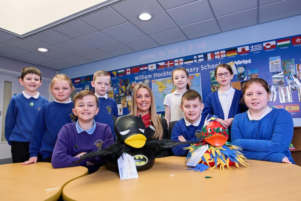 Redrow’s Kelly Toner, with the school council of William Stockton Primary School who helped decorate ducks for Chester Duck Race
